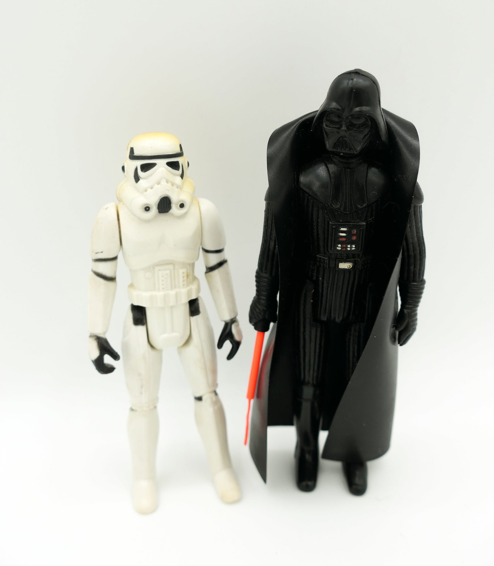 1977 Star Wars Action Figures: 1977 Kenner Star Wars 4 inch action figures including Darth Vader and Stormtrooper with gun. Stormtrooper figure shows some discoloration. Size: 4.5'h