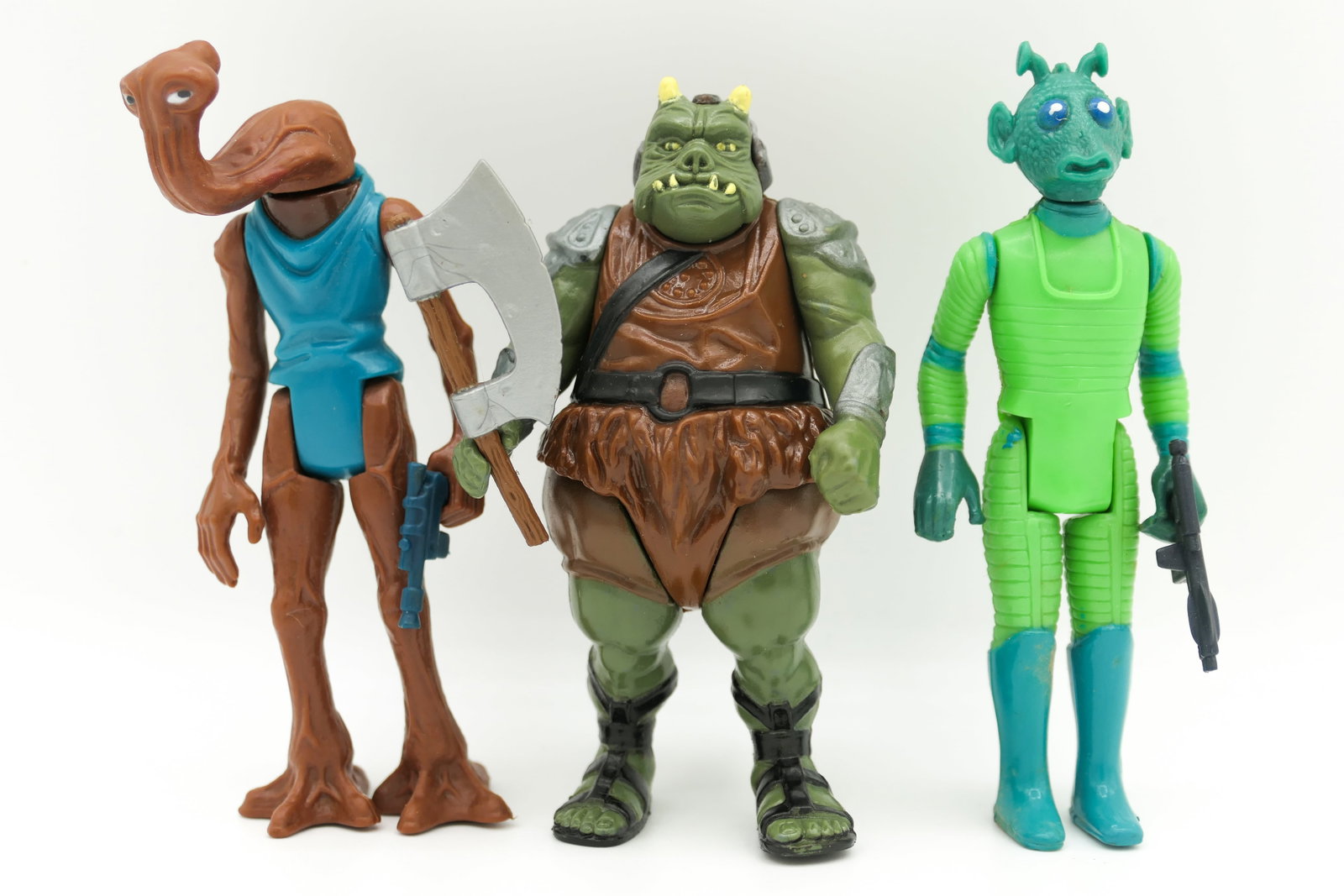 Star Wars Aliens Action Figures: Three Kenner Star Wars aliens 4 inch action figures including 1978 Greedo with gun, 1983 Gamorrean Guard with axe and 1978 Hammerhead alien. Size: 4.5"h
