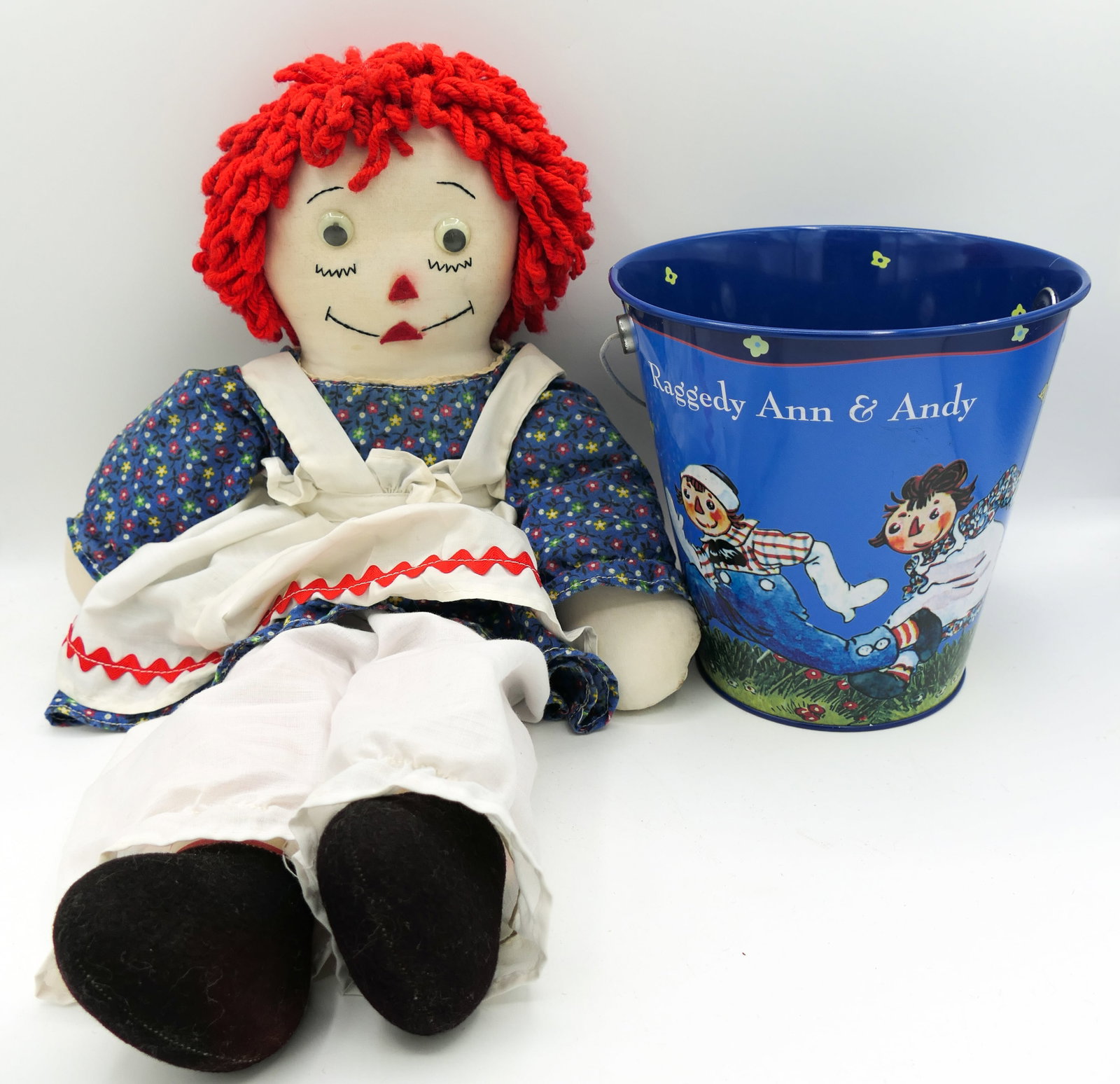 Hand Crafted Googly Eyed Raggedy Ann: Hand crafted googly eyed Raggedy Ann doll, plus a Simon and Schuster Inc. Raggedy Ann and Andy pail. Size: 21"l