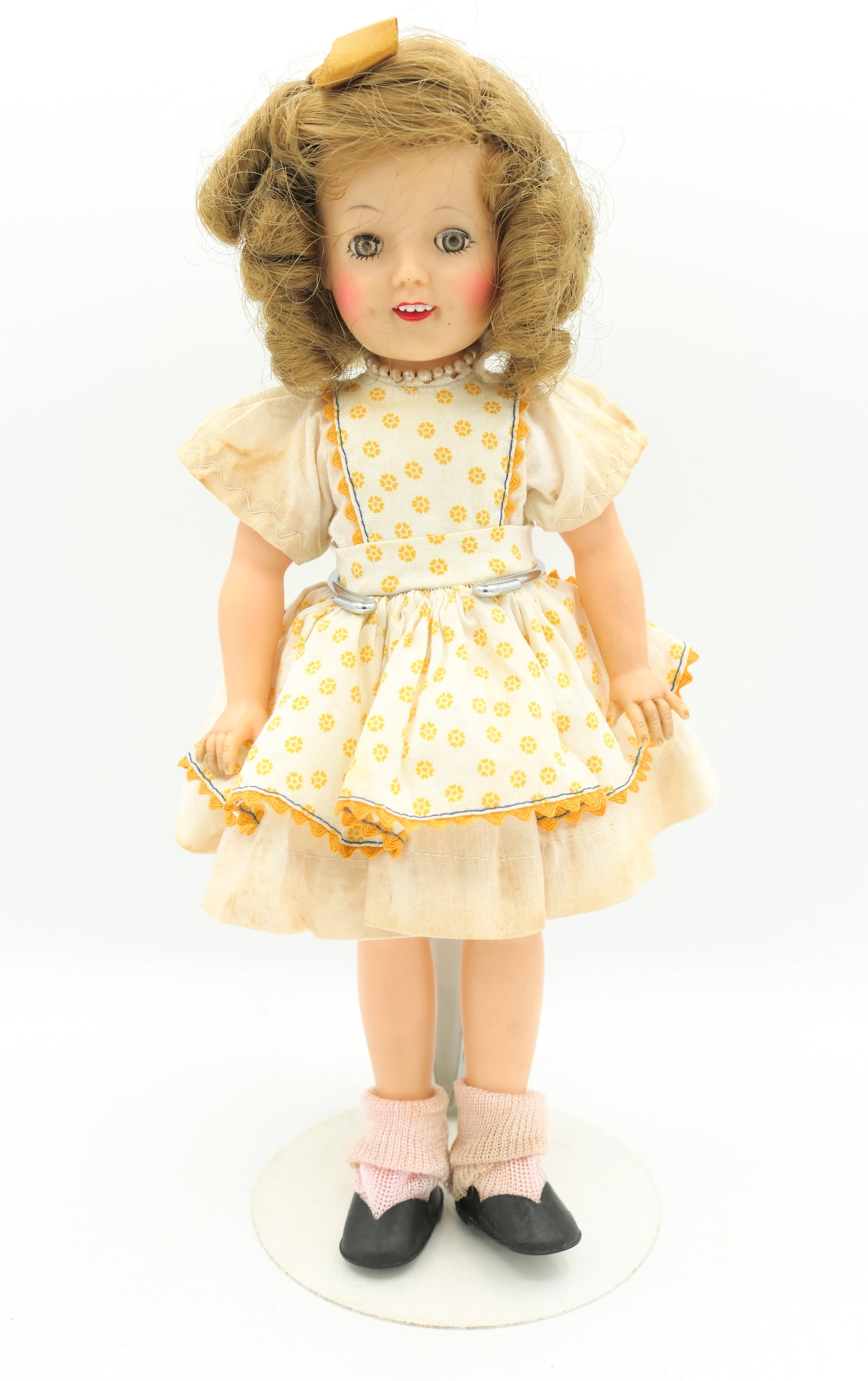 1950's Ideal Shirley Temple Doll: 1950's Ideal Shirley Temple doll, with stand. Shows wear consistent with age. Size: 12"h