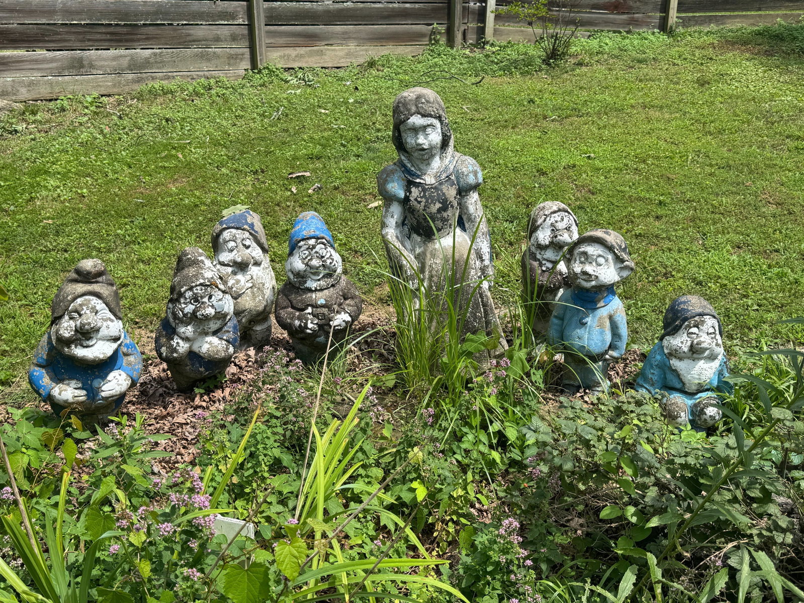 Snow White and the Seven Dwarfs Concrete Garden Set: Snow White and the Seven Dwarfs concrete garden set featuring all eight characters. They've been painted, but would come back to life and look incredible with a powerwash and repainting. Or, leave