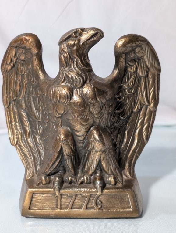 1968 Eagle Doorstop - Cast Brass Hampton VA: 1968 Eagle 1776 Doorstop - Cast Brass, Made in Hampton VA -Colonial Virginia, Marked 96E. Meas. 6"h x 4 1/4"w x 2 1/2"d. May also be part of a pair of bookends. Nice piece.