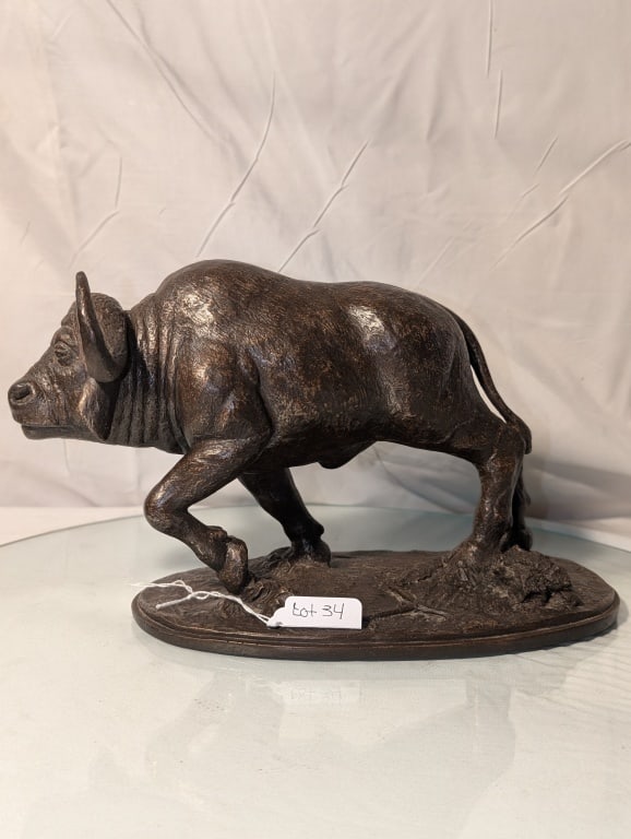 "Ready To Charge" Water Buffalo - Bronze P. DeNino: 1991 "Ready To Charge" Water Buffalo - Cold Cast Bronze Statue by Phil DeNino for the Franklin Mint. Label on bottom, Signed on base. Meas. 7 1/2"h x 13"w x 5 3/4"d. Nicely patinated, Very nice piece.