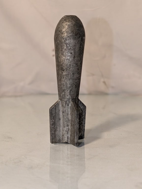 Vietnam / Korean War Practice Flechette: Vietnam / Korean War U.S. Navy Practice Flechette. Cast iron. Used for dive bomb training or low level procedures. Inert. Shows wear due to age. Meas. 4 1/4"h x 1 1/4"r.