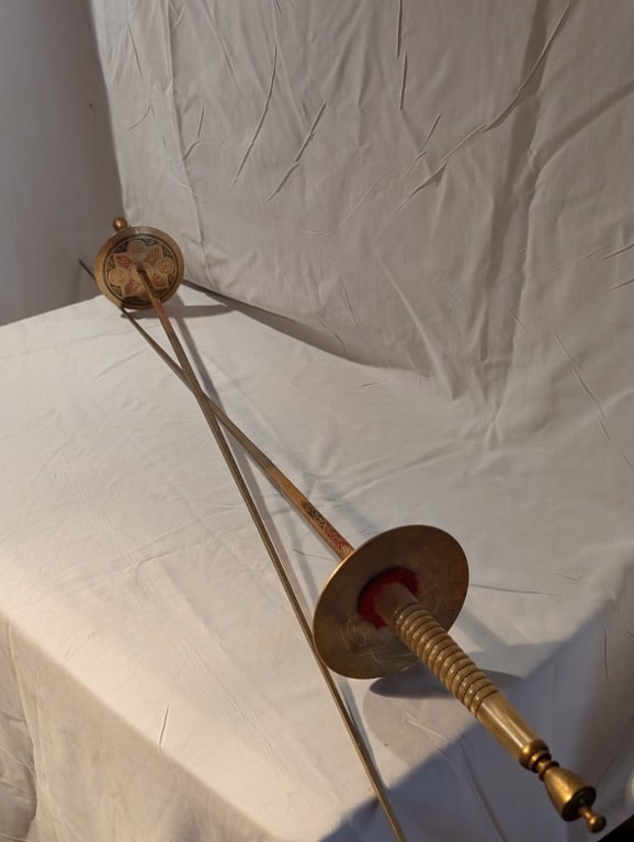 Vtg Fencing Swords (Pair) - Brass MoP Toledo Spain: Vtg Fencing Swords - Brass Mother of Pearl Toledo Spain. Enamel design in black and red. Ornate design etched on blades. Some discoloration on blades due to age and use. Meas. 42 1/2"l x 4"r