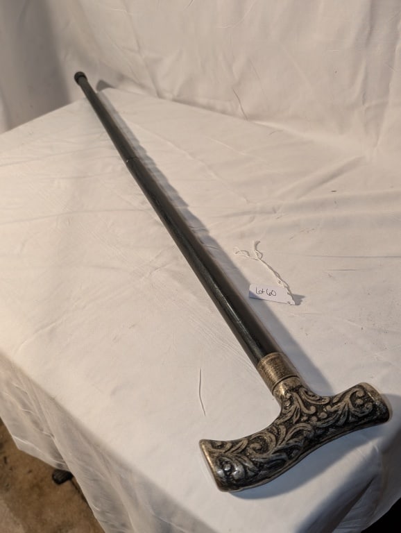 Antique Walking Cane - Nickel Handle: Antique Walking Cane - Nickel Handle / Hilt w/ fleur de lis design. Handle is contoured. Black wook shaft. Rubber stopper. Very nice piece. Meas. 34'h x 5"w x 1"d (hilt).