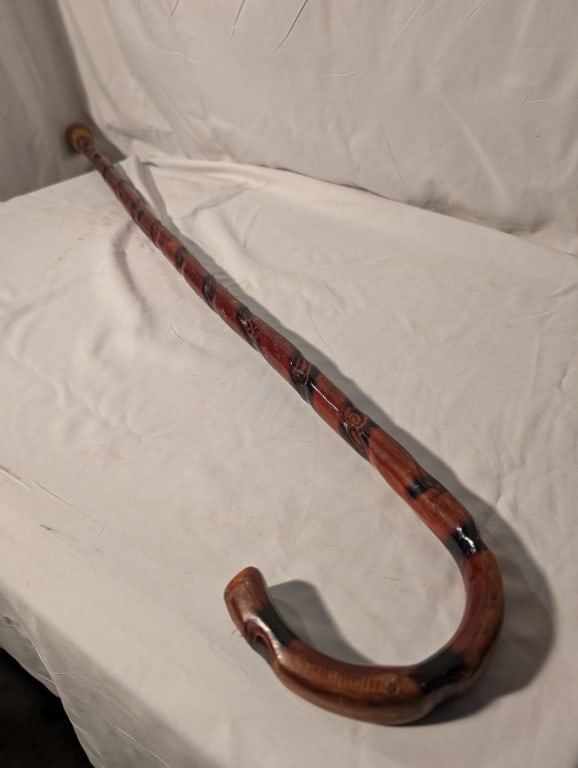 Antique Walking Cane - Hardwood Knot Accent Design: Antique Walking Cane - Hardwood Knot Accent Design. Stopper added after. Burnt wood design on shaft highlights wood grain. Nice piece. Meas. 35"l x 4 1/2"w. x 1"d.