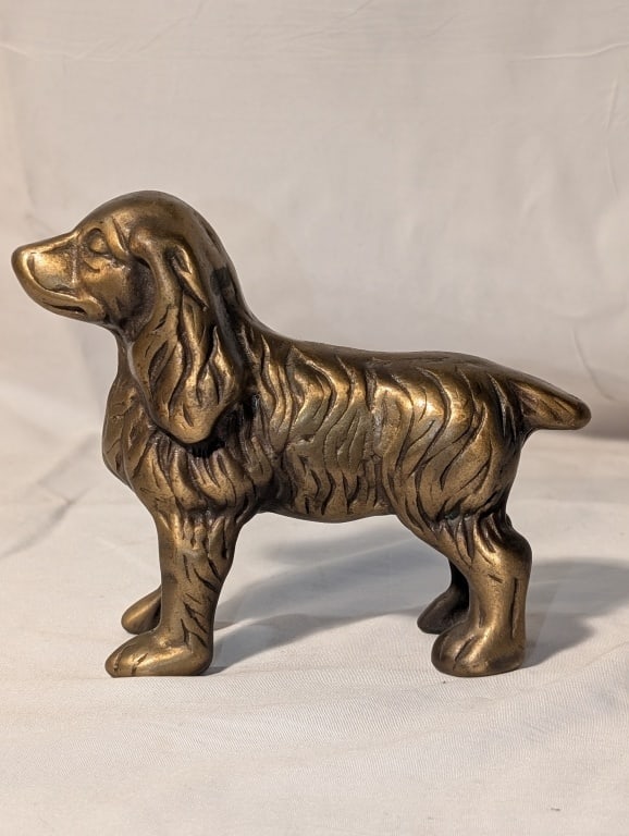 Brass Cocker Spaniel Figurine: Brass Cocker Spaniel Figurine. Very nice patina. Tail printed. Detailed. Meas. 6"d x 1 3/4w x 4 1/4"h. Nice collectible.