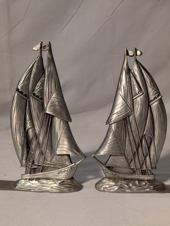 1991 Sailboat Bookends - Seagull Pewter Canada: 1991 Sailboat Bookends (Pair) - Seagull Pewter Canada. Marked on base. Meas. 6" x 5 3/4" x 1" each.