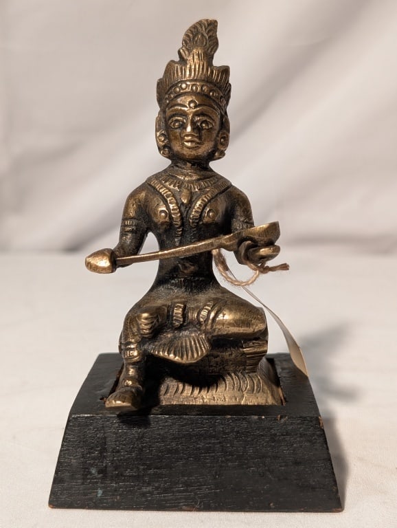 Hindu Deity Annapurna - Bronze Statue: Hindu Deity Annapurna - Bronze Statue represents nourishment and sustenance. Seated on a wooden black base. Meas. 5"h x 3"w x 2 1/2"l Nice patina.