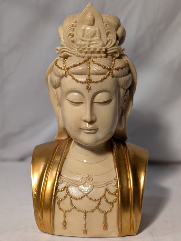 East Asian Deity - Guan Yin Bust - Resin: East Asian Deity - Guan Yin Bust - Resin. Bodhisattva of compassion, mercy, and kindness. Ivory colored bust w/ gold accents. Meas. 11"h x 5"w x 3 1/2"d.
