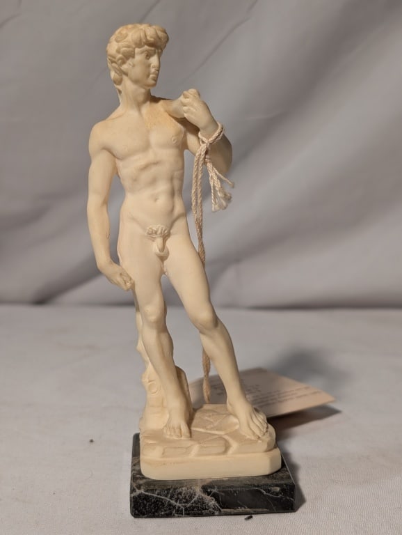 David - Oxolyte Statue, A. Santini, Italy: David (Michaelangelo) - Oxolyte Statue, A. Santini, Italy on black marble base. Original label on bottom and original paperwork. Meas. 6 1/2" by 2 1/4"sq. Nice piece.