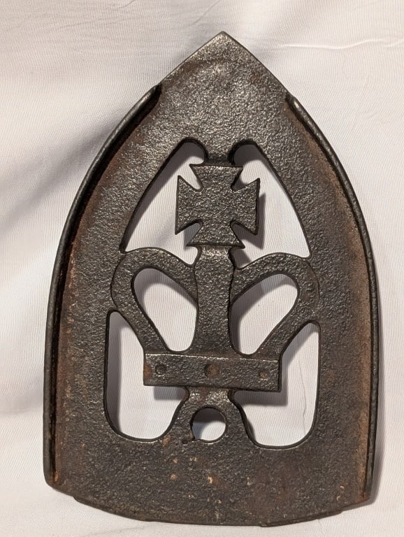 Antique Sadiron Trivet - CI Colebrookdale Iron: Antique Sadiron Trivet - Cast Iron. Crown w/ Cross. Colebrookdale Iron Company, Pottstown, PA. Meas. 1/4"h x 4"w x 6 1/4"d. Shows some wear.