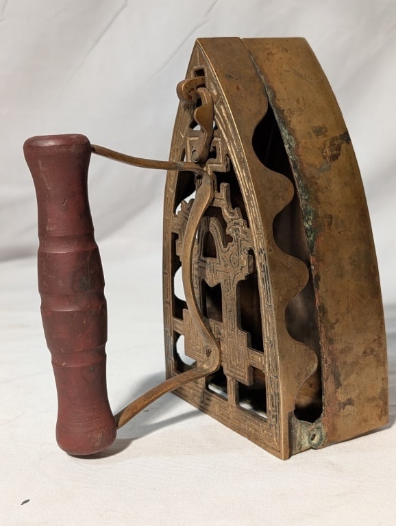 Sadiron w/ Coal Bin - Brass Wood Handle Taiwan: Sadiron - Brass Wood Handle Taiwan. Marked in side w/ hook clasp. Brass handle opens coal bin area. Shows wear from use and age. Meas. 6 1/2"h x 3 3/4"w x 5 1/4"d.