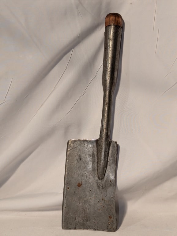 WWI Steel Entrenching Tool / Axe Wooden Knob: WWI Steel Entrenching Tool / Axe, Wooden Knob on Hilt. Shows wear from use, slight rusting. Meas. 14"l x 3 1/2"w x 1"d.