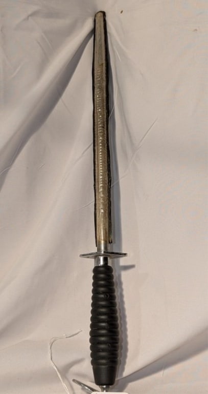 Knife Sharpener w/ Ribbed Handle, Hanging Ring: Steel Knife Sharpener w/ Black Ribbed Handle, Chrome Hanging Ring with Slip Guard. Shows some wear due to age. Meas. 17 1/4h" x 2"w x 1"d.