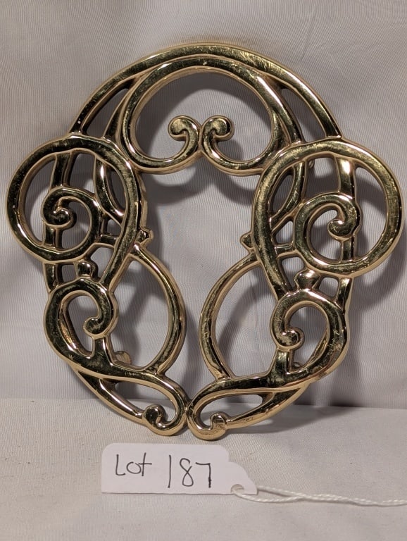 Brass Trivet - Musical Clef Design - Baldwin: Brass Trivet - Musical Clef Design - Baldwin Brass. Historic Savannah marked on reverse. Footed. Meas. 1"h x 5 1/4"w x 5"d. Shows minimal wear.