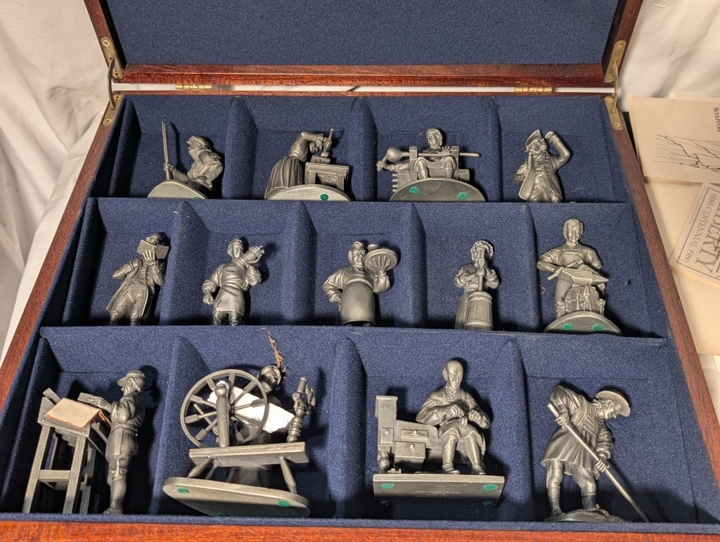 1974 Franklin Mint Fine Pewter Collection 13pc: 1974 Franklin Mint Fine Pewter Collection 13 piece in original wooden box with individual placement holders. Includes: planter, shoemaker, spinner, printer, blacksmith, butter churner, trapper,