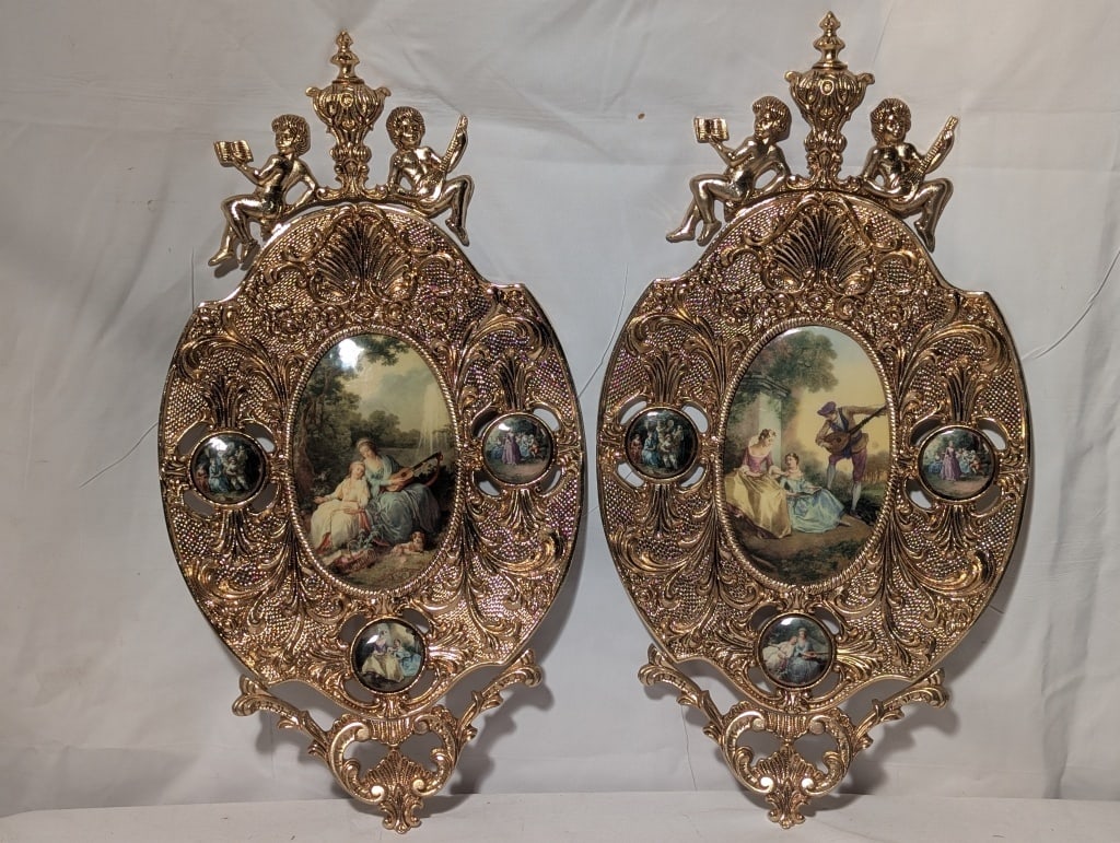 Pair Brass Cherub Frames w/ Victorian Enamel Pics: Pair of Brass Cherub Frames w/ Victorian Enamel Pictures. The frames are exquisitely detailed with Cherubs at the base of the finial. Each contains 3 small round enamel on porcelain Victorian