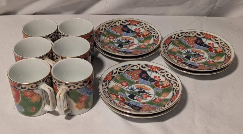 Porcelain Demitasse Set of 6 Japan Andrea by Sadek: Porcelain Demitasse set of 6, Andrea by Sadek, Japan. 12 pieces include cup and saucer. Signed w/ label. Art deco design in orange/green/blue/black. Gold leaf edging. Cup meas. 2/12'h x 3"w xx 2 1/2"d