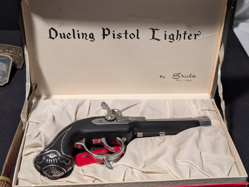 Dueling Pistol Lighter by Shields Orig. Box (1481): Dueling Pistol Lighter by Shields in original box, No. 1481. From 5th Avenue Gifts. Like new condition, box some minor wear from age. Pistol Meas. 1/4"h x 7"3/4"w x 3"d. Box meas. 1 1/4"h x 8 