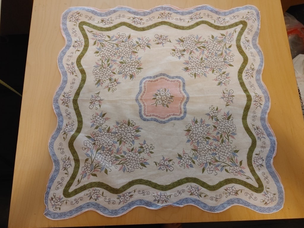 1970s Accent Scarf, Hanky, Doily, Floral Design: 1970s Accent Scarf, Hanky, Doily, Floral Design. Scalloped edge, pink edge. Blue/Green ribbons on white background. Cotton Meas 15"sq.