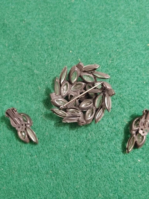 Vtg Mirrored Beaded Brooch & Earring Set: Vtg Mirrored Beaded Brooch & Earring Set. Leaf pattern brooch has rounded shape with black background and mirrored jewels, meas. 1 3/4"r. Matching clip-on earrings meas. 1 1/4"l. Very nice condition. 