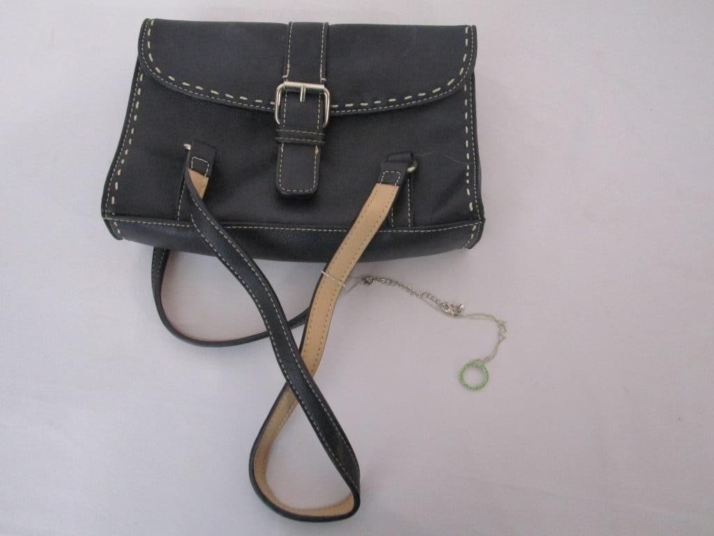 Liz Claiborne Black Leather Hand Bag: Liz Claiborne Black Leather Hand Bag. 2 handles w/ belt buckle snap closure. 2 zipped compartments. Pink/orange interior design. Logo signature sewn interior. Meas 6"h x 9"w.