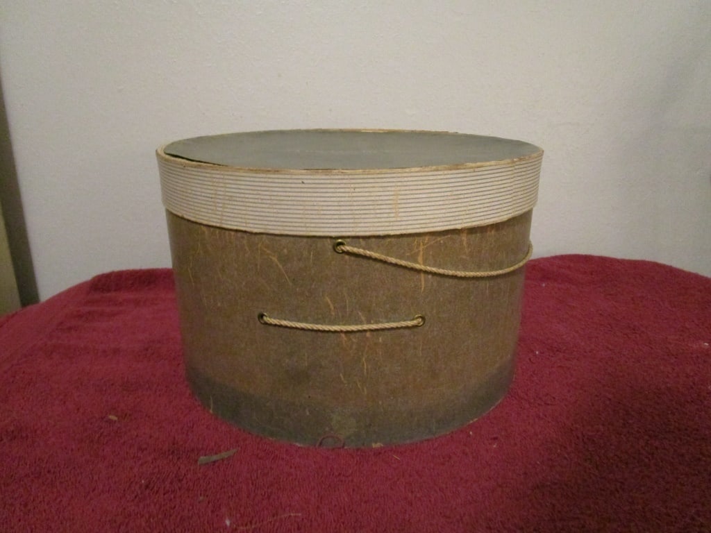 1940s Hat Box, Hecht's Washington DC: 1940s Hat Box, Hecht's Washington DC. Original rope. Bottom separation, considerable wear and discoloration from age and use. Top label shows loss. Top has some separation. Meas. 7"h x 12 1/4"r.