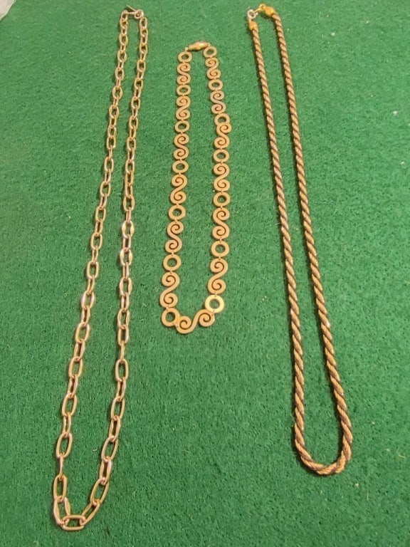 GP Chain Collection (Set of 3): Gold plated chains. 1 w/ scroll design and round ring links, meas 8" w/ a barrel clasp. 2 have open links - 1 engraved Whiting Davis meas. 13"l, the other is a twisted rope black/gold chain meas 12"l.