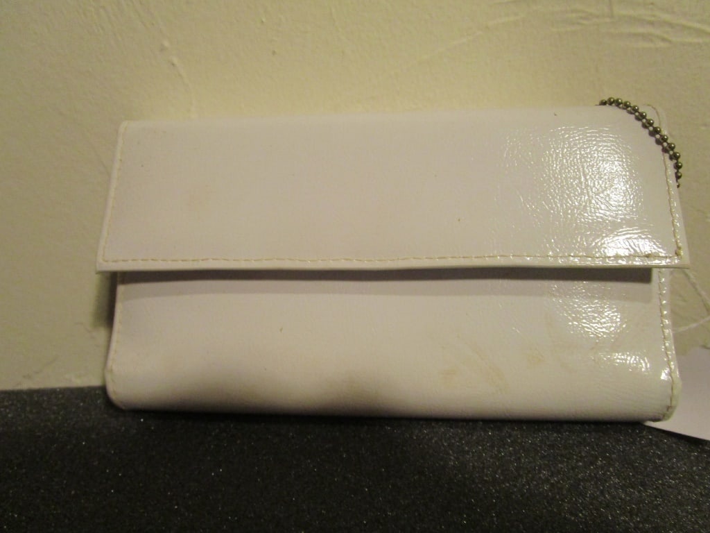 Vtg White Clutch: Vtg White Clutch, faux leather, snap closure and keychain. 2 zipper compartments inside with credit card / picture sleeves, check register area. Note: color apprears cream in photos - it is white. Mea