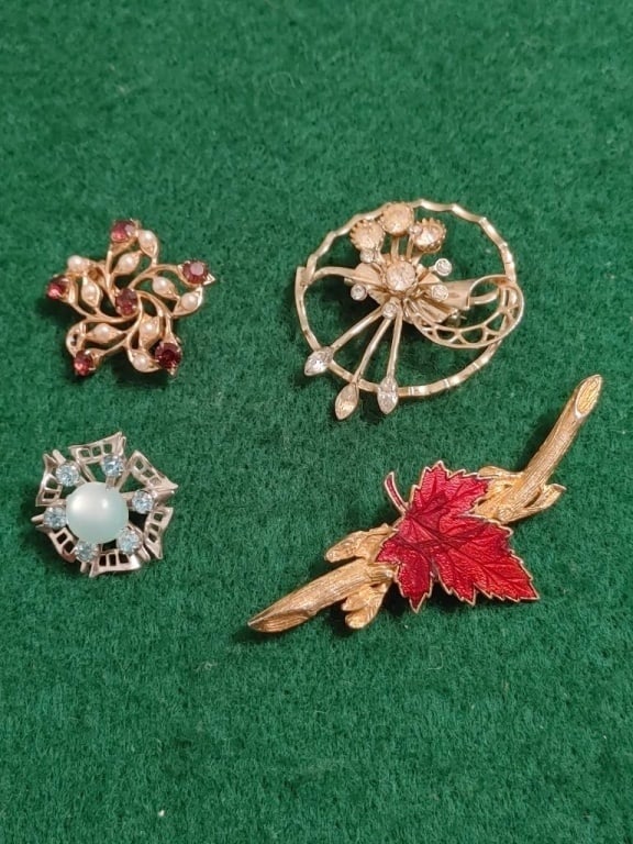 Vtg Brooch Collection (Set of 4): Vintage brooch collection. Set of 4. 1 - round floral design w/ cubic zirconias, meas 1 1/2"round, 2 - red maple leaf w/ branch, enameled on gold plate, meas 2 3/4"w. 3 - round w/ blue turquoise on si