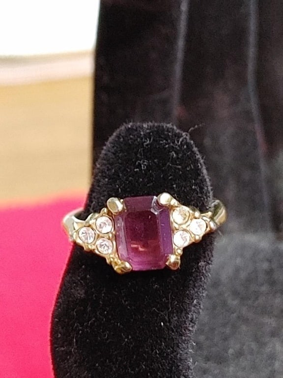 Amethyst Gold Plated Ring Size 6: Ring gold plated size 6. Center square stone is amethyst with 3 small cz stones. Like new condition.