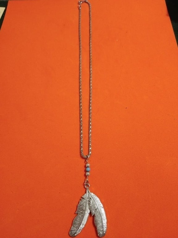 Sterling Indian Feather Necklace: Sterling Indian Feather Necklace. Sterling chain meas 9", Indian silver plated pendant has feather design and genuine turquoise beads. Chain meas 9"l, Pendant meas. 2 1/2"l