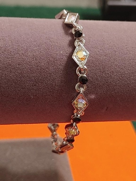 SP Bracelet w/ Onyx Beads & Austrian Crystals: SP Bracelet w/ Onyx Beads & Austrian Iridescent Crystals . Set in diamond shaped frames. Colors are brilliant, very nice piece.