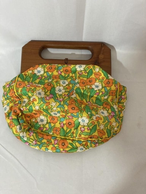 Vtg Trimingham's Bermuda Bag w/ Wooden Handle: 1960s Trimingham's Bermuda Bag w/ Wooden Handle. Bright multicolored floral cloth pattern. Brass hinges and wooden closure. Interior is cream satin w/ interior pouch. Minor discoloration and wear on h