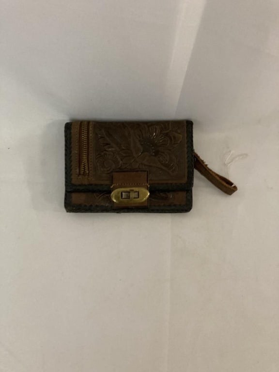 '60s Embossed Floral Leather Wallet w/ Wrist Strap: 1960s western style embossed floral pattern wallet w/ wrist strap and brass twist lock closure. When opened outer zippered billfold pocket. Made in Mexico. Exterior has braided trim. Interior has mirr