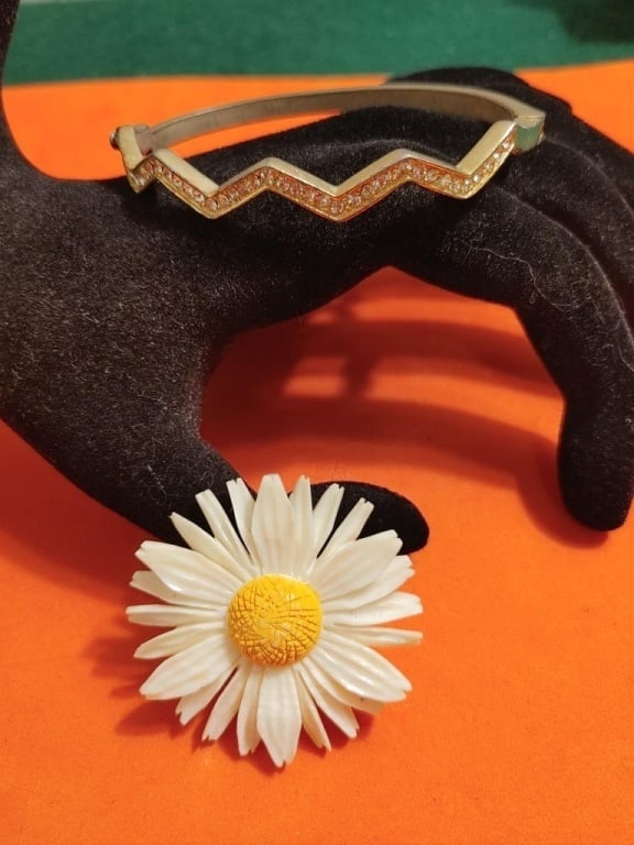 Brass Bracelet w/ CZ & Acrylic Daisy w/ SS Pinback: Vintage Brass Bracelet w/ Cubic Zirconia inlay with wave design and safety clasp. Acrylic Daisy w/ Sterling Silver Pinback. Bracelet meas 2 1/2"closed. Pin meas 1 3/4"round. All in very nice condition