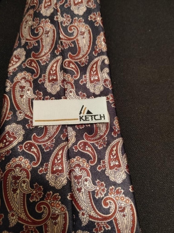 Ketch Paisley Tie: Ketch Paisley Tie. Black background, red. cream paisley design. Like new.
