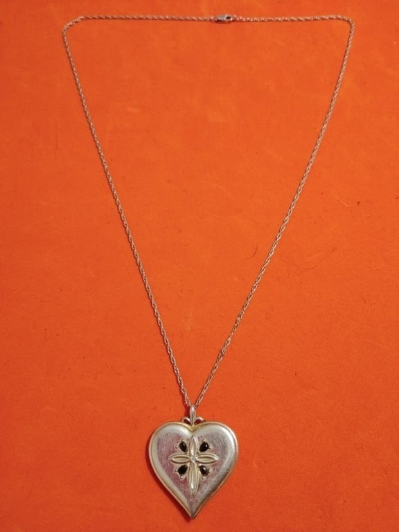 Sterling Heart Necklace Inscripted to Daughter: Sterling silver necklace with heart inscripted to daughter. Front of heart has onyx stones and cross, back has inscription. Heavy. Chain 10"l. Heart 1 1/4 sq.