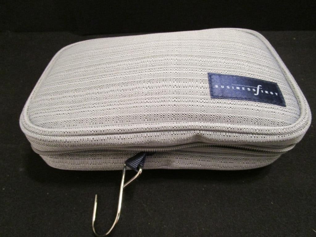 Vtg Continental Airlines 1st Class Travel Kit - NU: Vtg Continental Airlines Business 1st Class Travel Kit. Hanging travel bag with accessories. Includes toothpaste/brush, lotion, cleansing cloth, socks, eye mask, tissues, lip balm, pen, comb/brush, ea