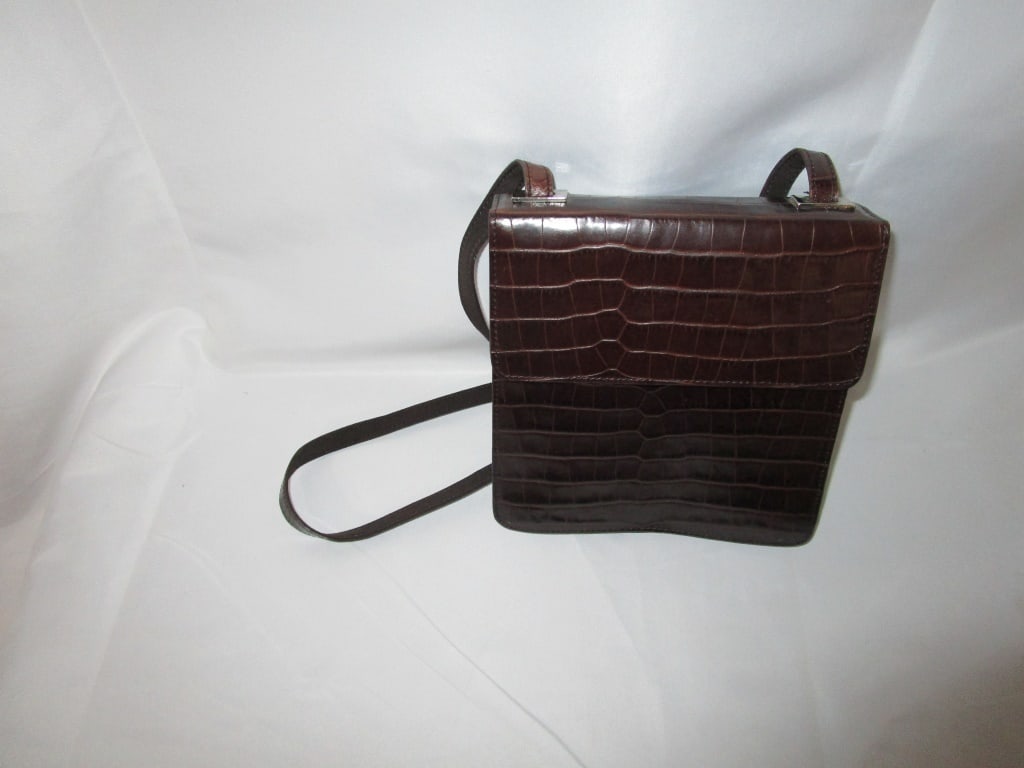 Vtg Enzo Angelini Brown Leather Croc Shoulder Bag: Vtg Enzo Angelini Brown Leather Croc Shoulder Bag. Top fold to chrome magnetic snap Leather strap. Interior logo print fabric w/ side zippered pocket. Meas. 7 1/5"h x 7"w x 3"d. Strap meas. 20". Very