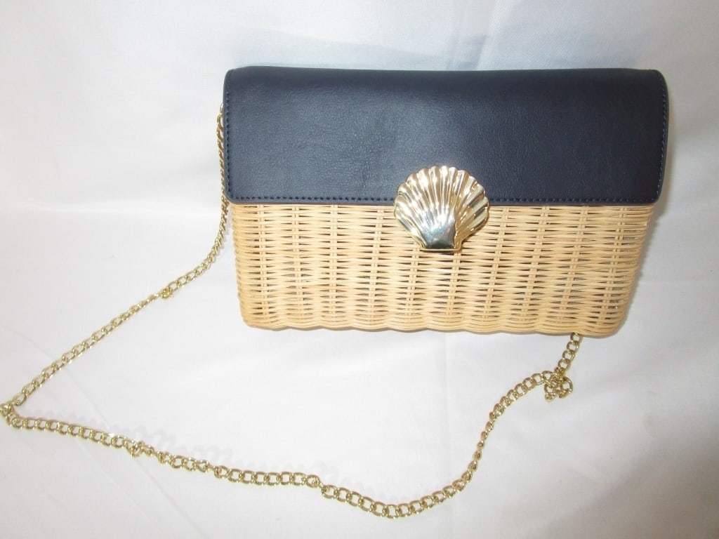 Vtg Talbot's Navy & Wicker Hand / Shoulder Bag: Vtg Talbot's Navy & Wicker Hand / Shoulder Bag w/ brass shell magnetic closure on front. Hinged interior. Top flap close. Gold chain. Interior has side zipper pocket w/ tag and logo. Slight wear on ma