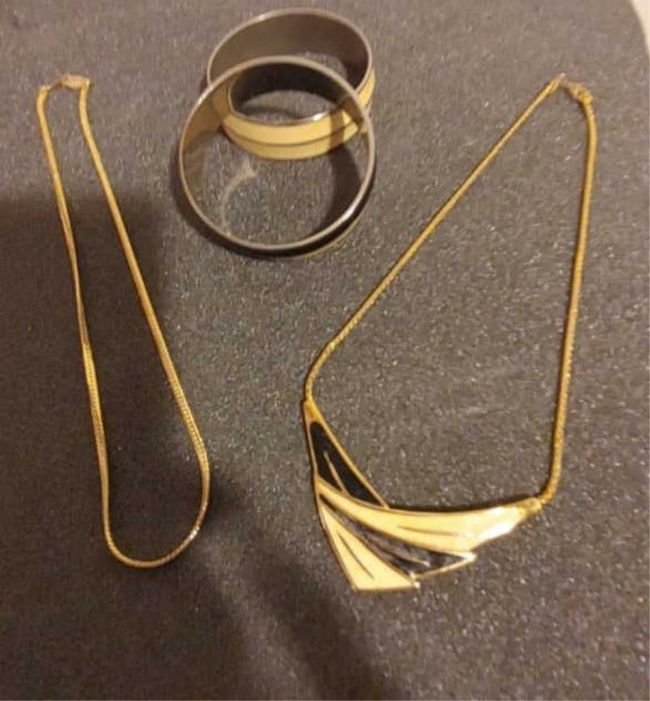 Chevron Necklace & Bracelets Grouping #10: Chevron Necklace & Bracelets Grouping. 1 Chevron necklace, 1 gold plated chain and 2 bangles. Chevron meas 8 1/2", chain 9", 2 black/gold bangles.