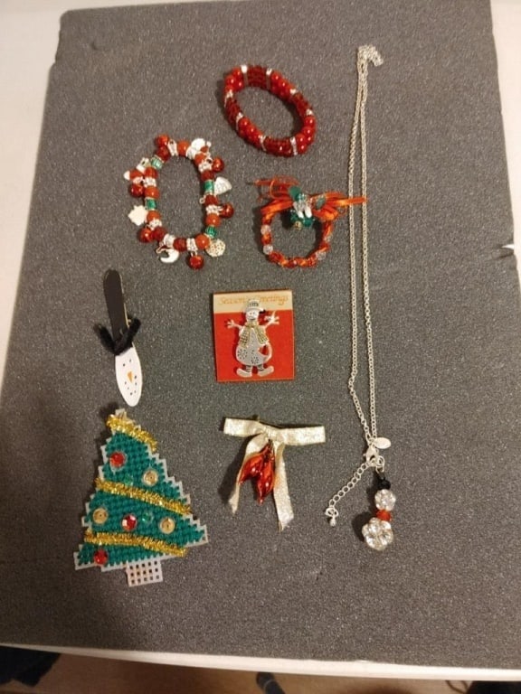 Christmas / Holiday Jewelry Grouping #7: Christmas / Holiday Jewelry Grouping. Chain & elastic bracelets, 4 pins, and 1 snowman necklace.