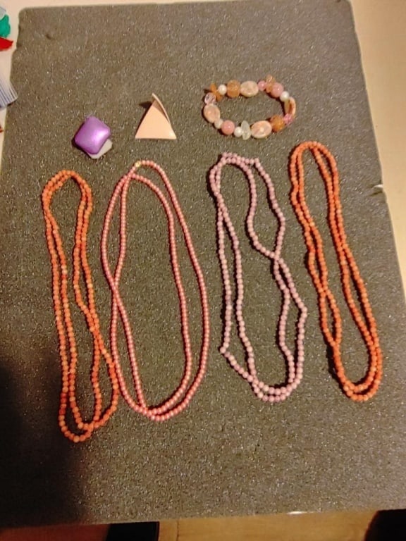 Necklace & Others Jewelry Grouping #14: Necklaces Earrings and Bracelet Grouping. 4 beaded necklaces meas 9", 1 elastic bracelet, 2 pairs of clip-on earrings. Colors pink and coral. All in very nice condition.