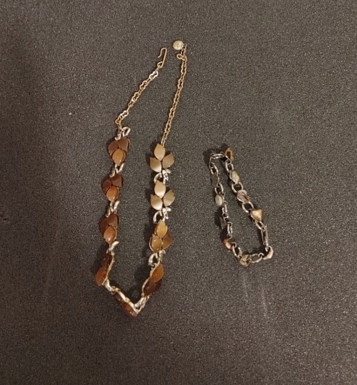 Tiger Eye Necklace and Bracelet #2: Tiger Eye Necklace and Bracelet. Floral design leaf effect on the necklace meas 8"l. Bracelet meas 3"l. Nice coloring in the gem stones. Silverplate.