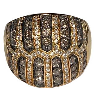 LeVian Chocolate and White Diamond Bombe' Ring: 18K yellow gold chocolate diamonds 31 round faceted chocolate diamonds 0.93 carats. 94 full cut diamonds 0.47 carats. Diamonds grade SI1-I1 in clarity and chocolate & G-I in color. Ring weighs 15.60
