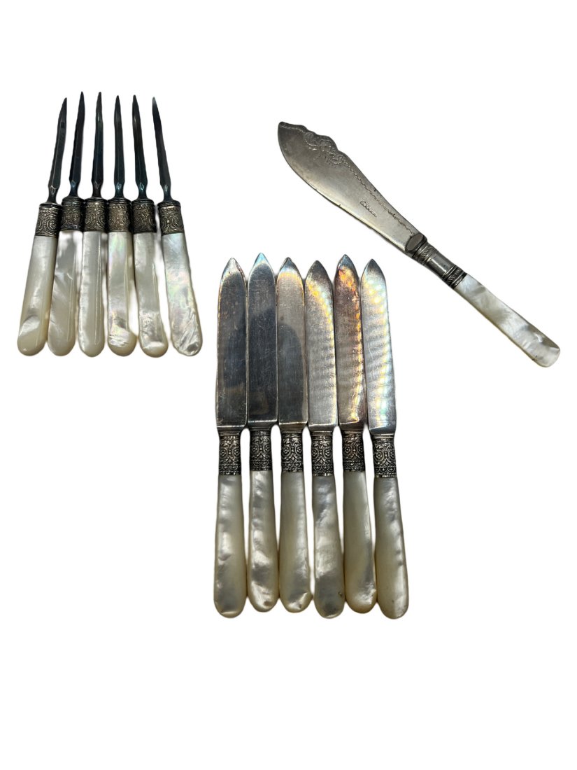 Antique Mother of Pearl Flatware, 6 Seafood picks, 6 Dinner knives, and 1 Master Butter Knife: All items in the lot are antique with a Mother of Pearl Handle. The set of dinner knives are marked sterling on the handle, and they are by maker J Russel and Co circa 1830s. Each dinner knife is 6 in