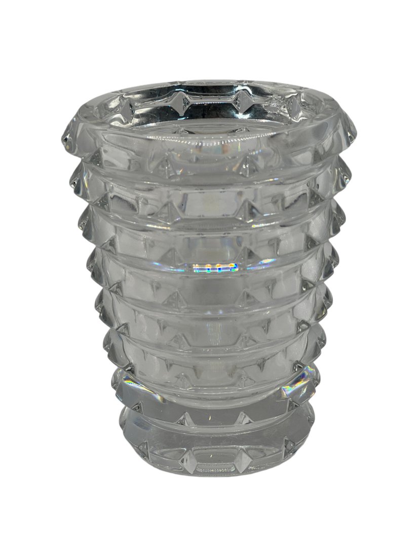 Baccarat Vase with Geometric Crystal Prisms, made in France: This vase made by Baccarat has circular tiers and inverted diamond cuts. It is a modernist form with a geometric pattern. It is signed on the bottom. It is 5.25 inches tall and 4.25 inches wide. It we